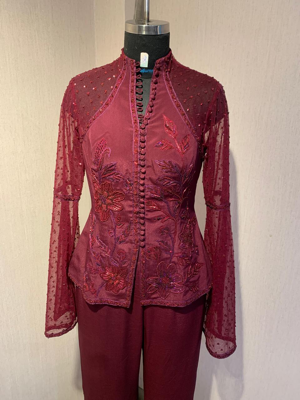 MAROON HAND-EMBROIDERED SHEER JACKET TOP WITH WIDE-LEG PANTS.