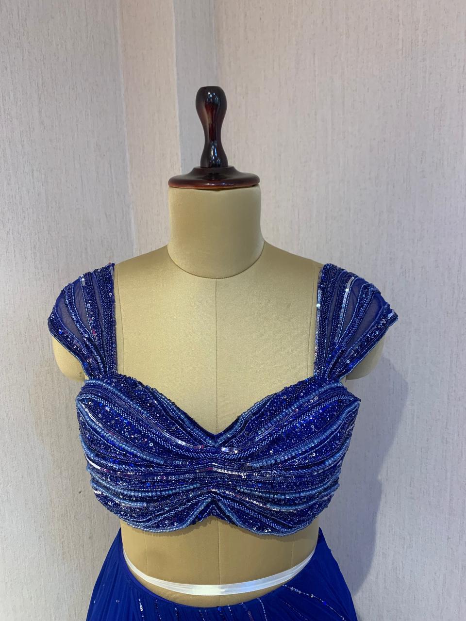 BLUE EMBELLISHED BLOUSE WITH DRAPED SAREE.