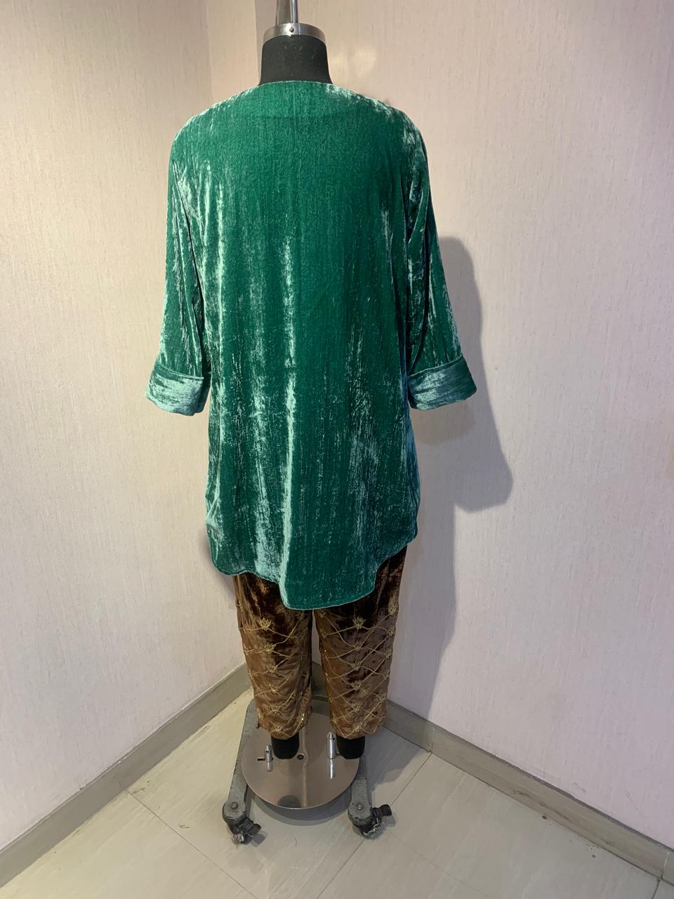 EMERALD VELVET KURTA WITH BROWN EMBROIDERED PANTS.