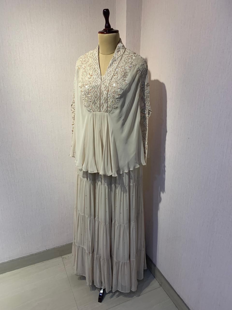 OFF WHITE TOP SKIRT WITH INNER SET & PEARL DETAILING AND EMBROIDERED NECKLINE.