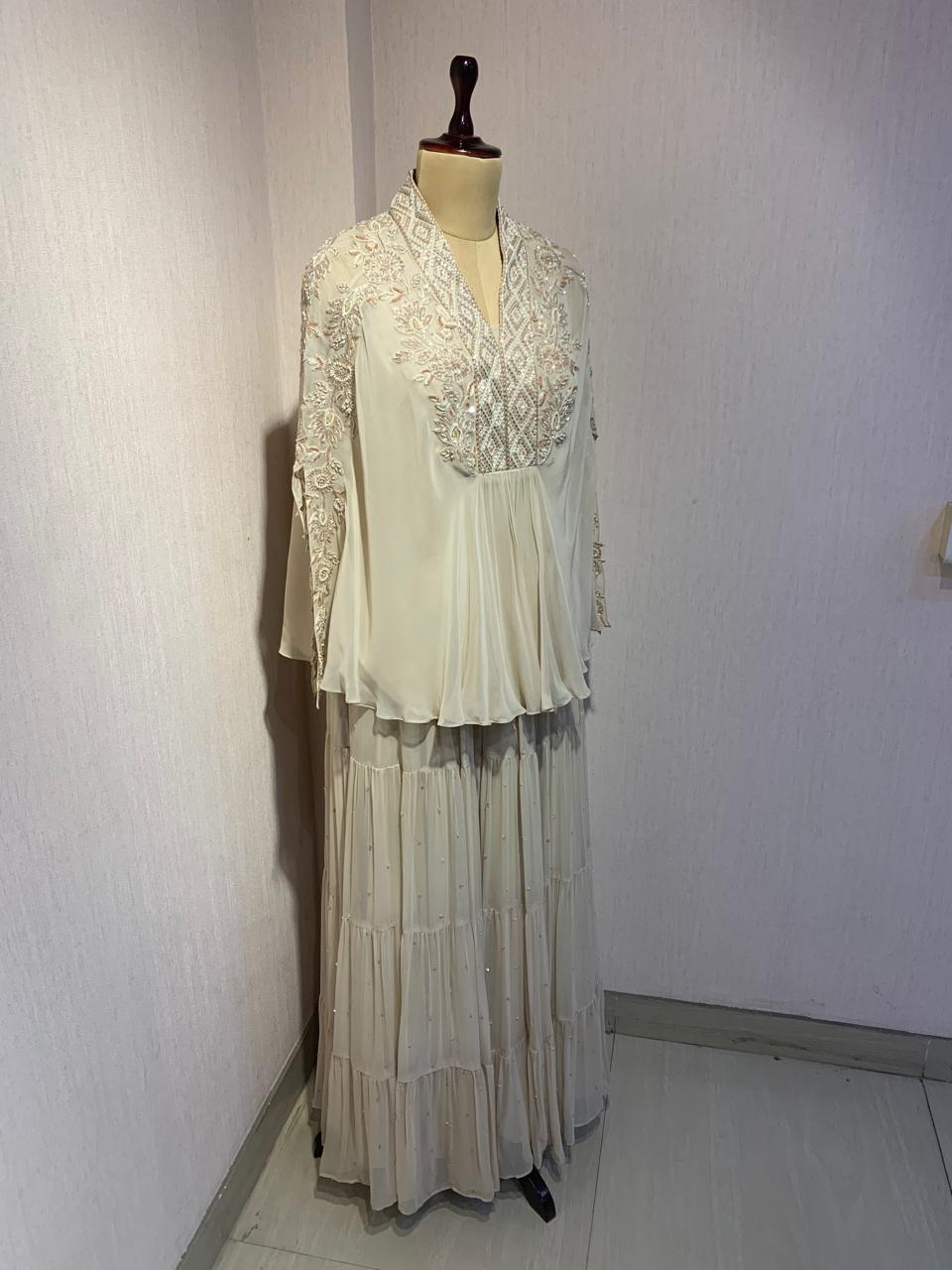 OFF WHITE TOP SKIRT WITH INNER SET & PEARL DETAILING AND EMBROIDERED NECKLINE.