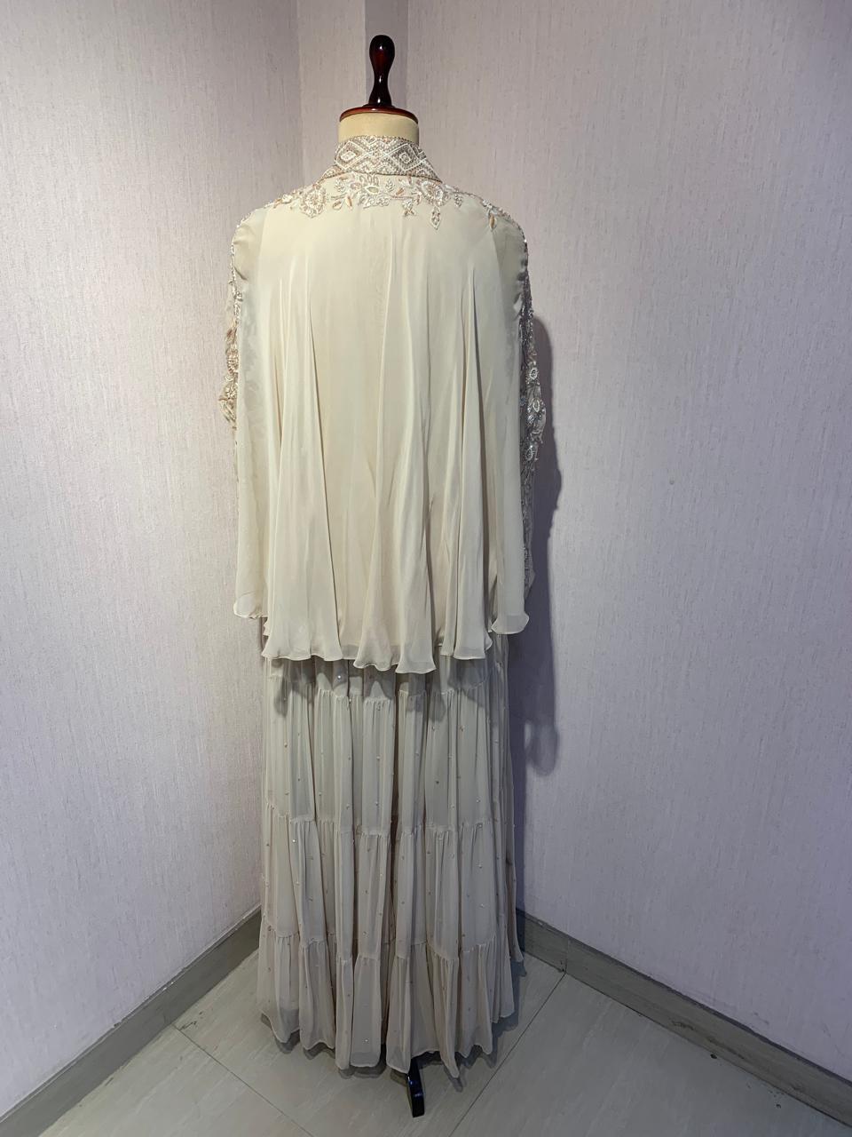 OFF WHITE TOP SKIRT WITH INNER SET & PEARL DETAILING AND EMBROIDERED NECKLINE.