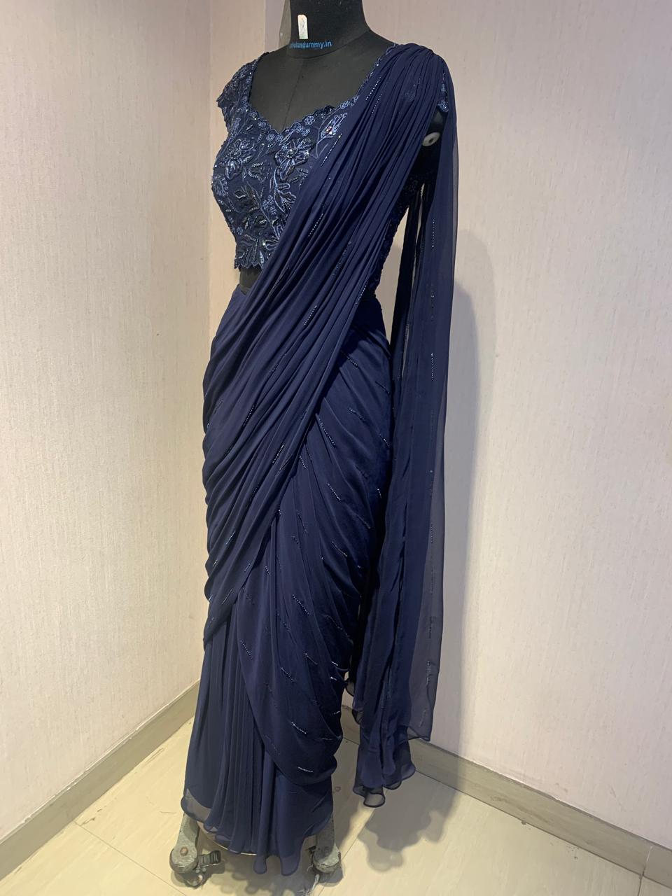 NAVY BLUE DRAPE SAREE WITH EMBROIDERED BLOUSE.