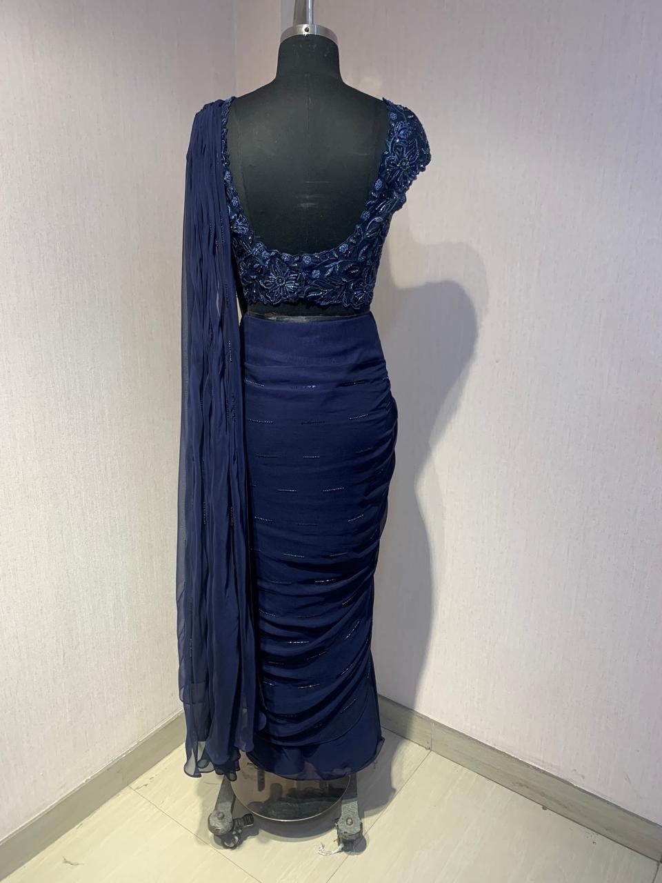 NAVY BLUE DRAPE SAREE WITH EMBROIDERED BLOUSE.