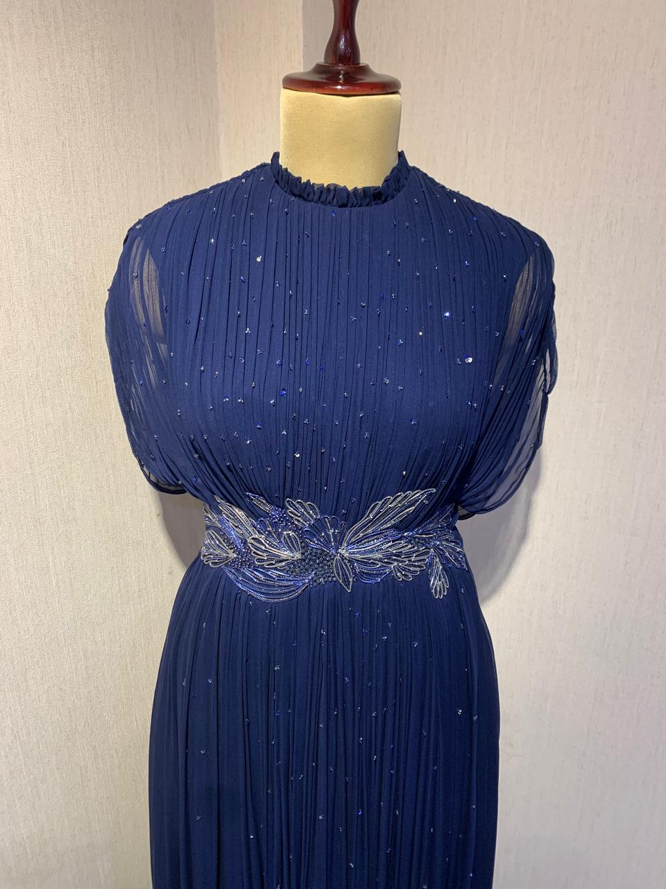 BLUE WIRE EMBELLISHED PLEATED GOWN WITH SHEER SLEEVES.