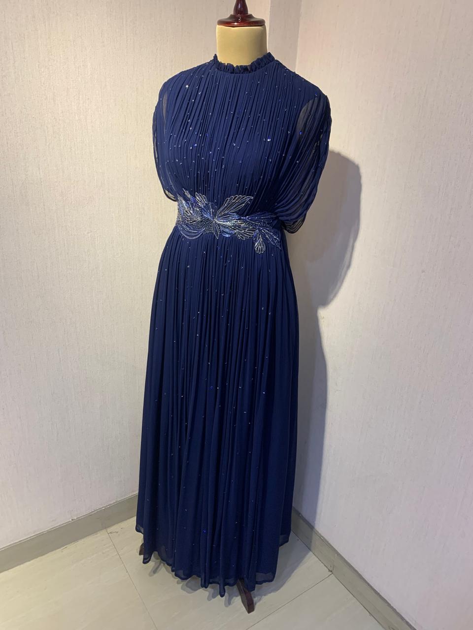 BLUE WIRE EMBELLISHED PLEATED GOWN WITH SHEER SLEEVES.