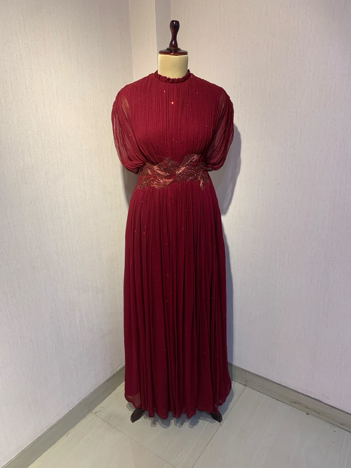 MAROON WIRE EMBELLISHED PLEATED GOWN WITH SHEER SLEEVES.