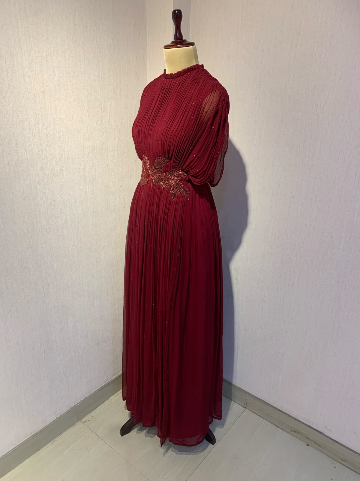 MAROON WIRE EMBELLISHED PLEATED GOWN WITH SHEER SLEEVES.