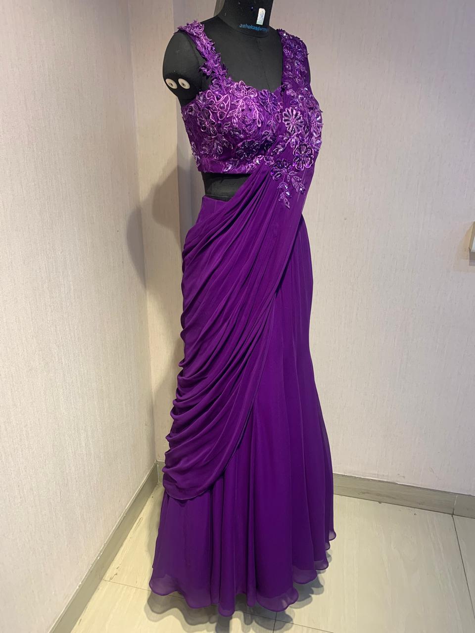 THE DELICATE FLORAL EMBROIDERY ON THIS DRAPE SAREE ADDS A TOUCH OF ELEGANCE AND CHARM.