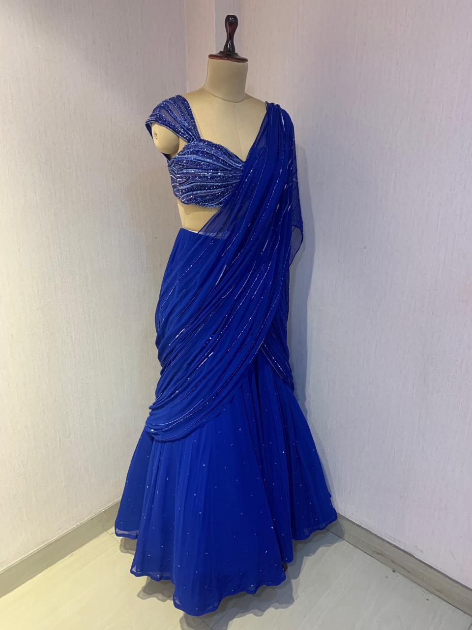 BLUE EMBELLISHED BLOUSE WITH DRAPED SAREE.