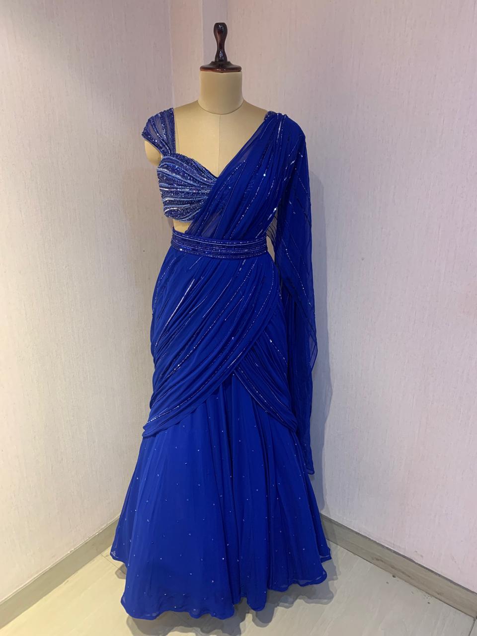 BLUE EMBELLISHED BLOUSE WITH DRAPED SAREE.