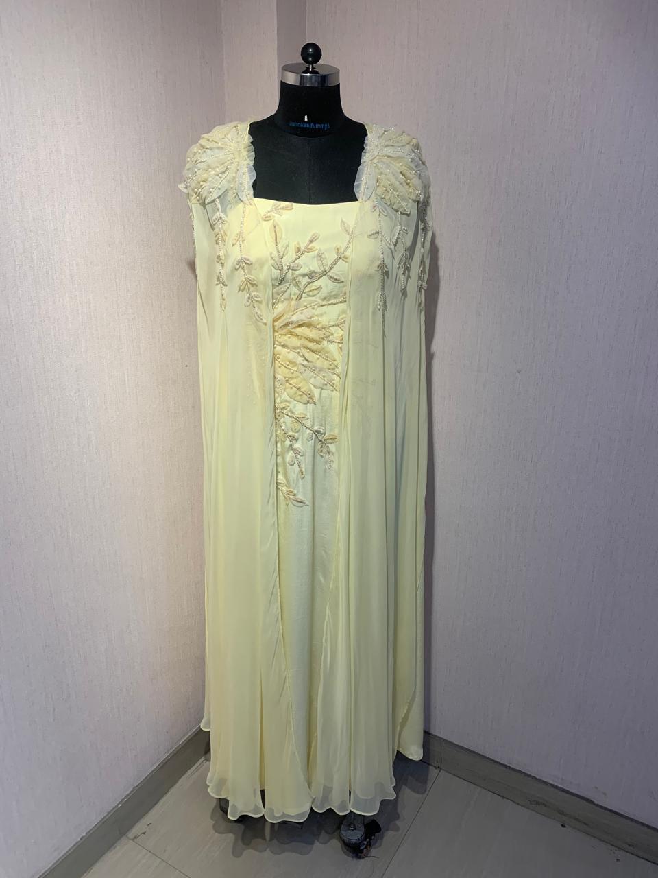 FLORAL EMBROIDERED CAPE GOWN.