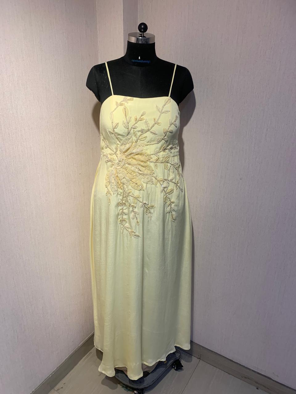 FLORAL EMBROIDERED CAPE GOWN.
