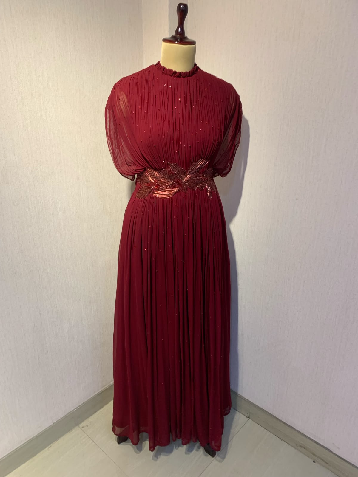 MAROON WIRE EMBELLISHED PLEATED GOWN WITH SHEER SLEEVES.