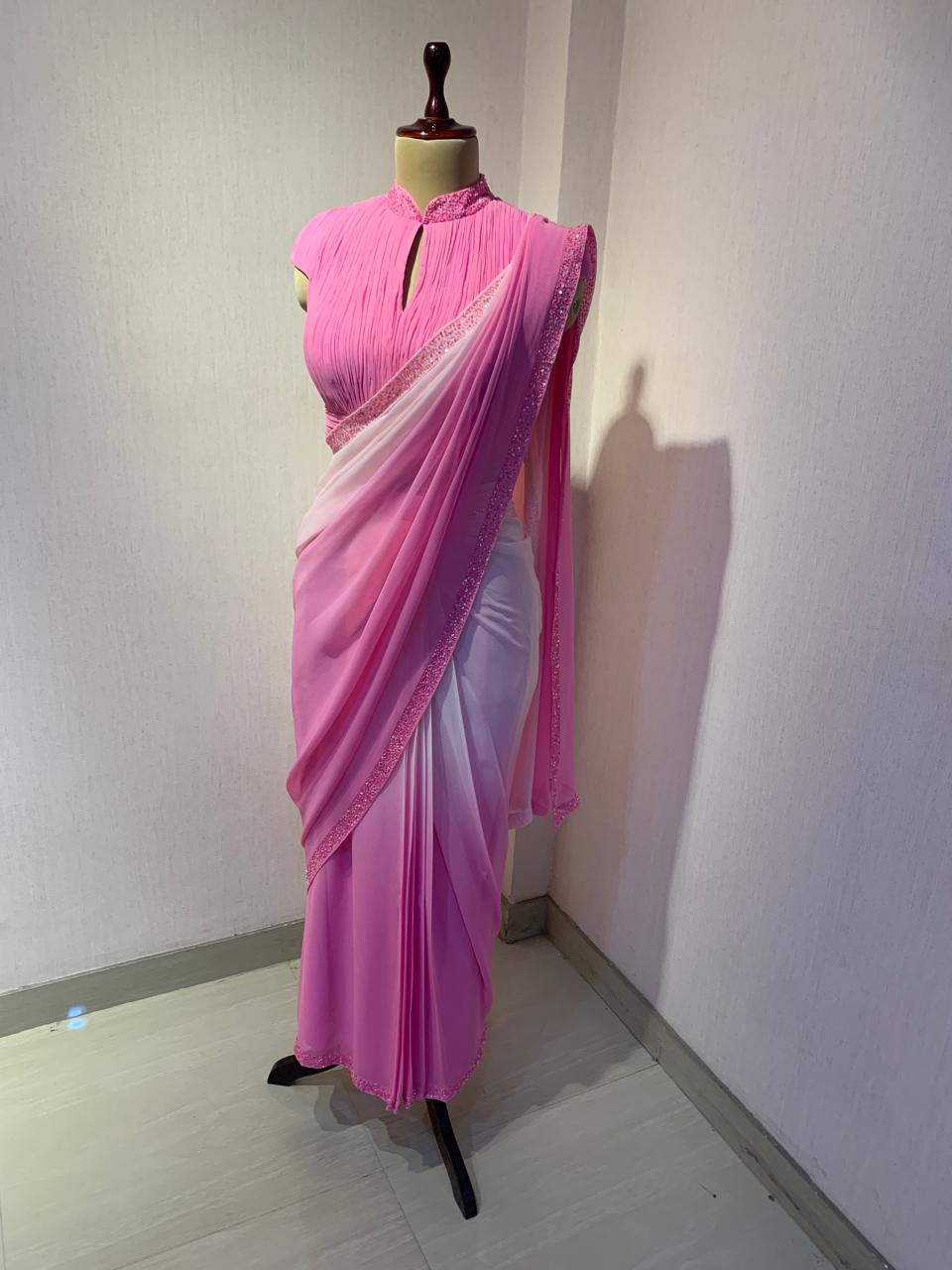 OMBRE GEORGETTE DRAPED SAREE WITH PLEATED HIGH NECK BLOUSE.