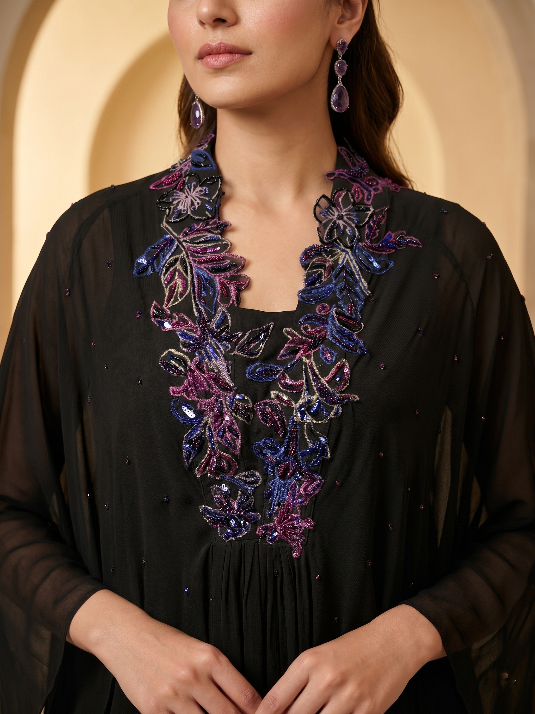 ELEGANT BLACK CAPE TOP WITH FLARED PALAZZO PANTS.